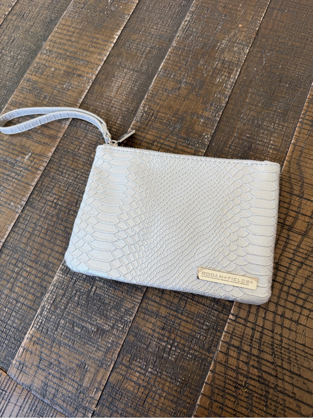 Rodan + Fields Light Gray Embossed Wristlet Clutch